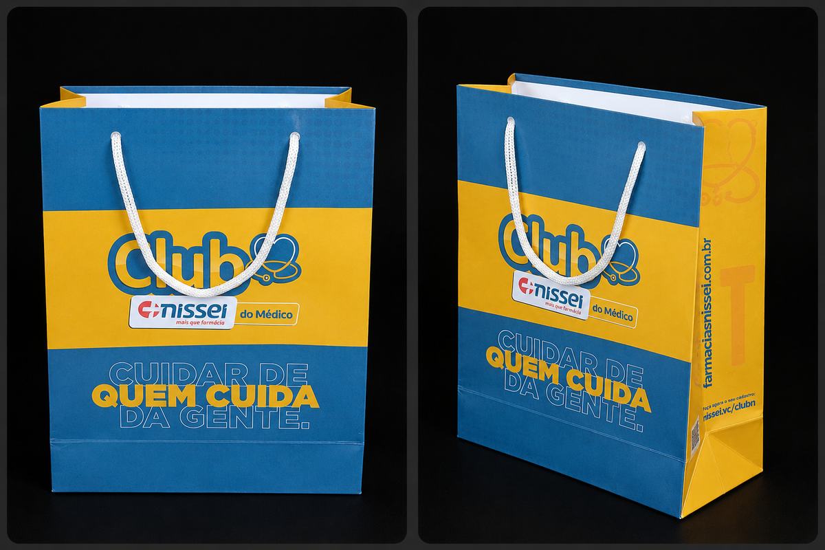 Sacola premium azul e amarela com impressão colorida — Club Nissei do Médico